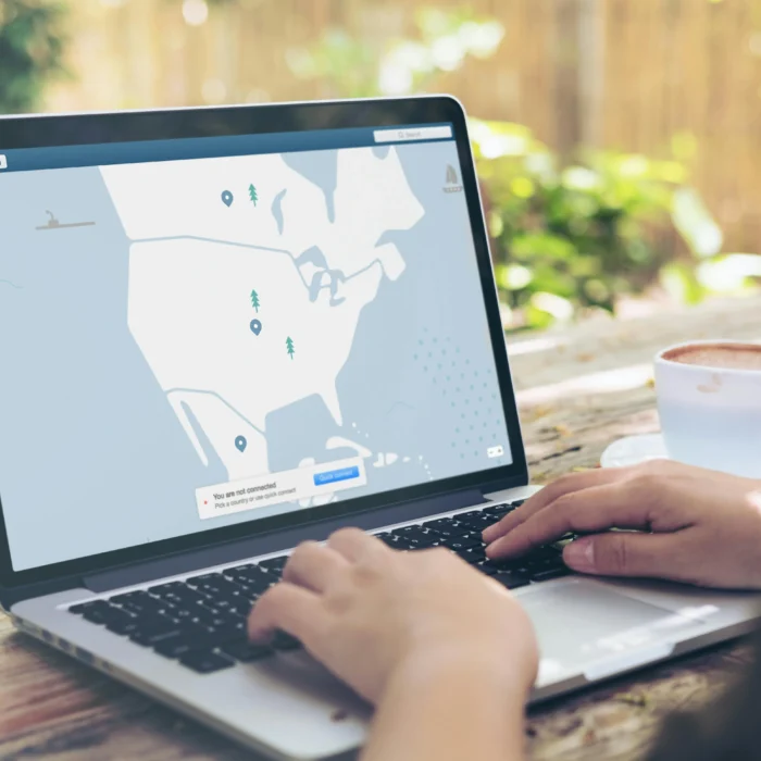 Local WordPress web designer meeting a client with a laptop showing a responsive WordPress website mockup and project checklist