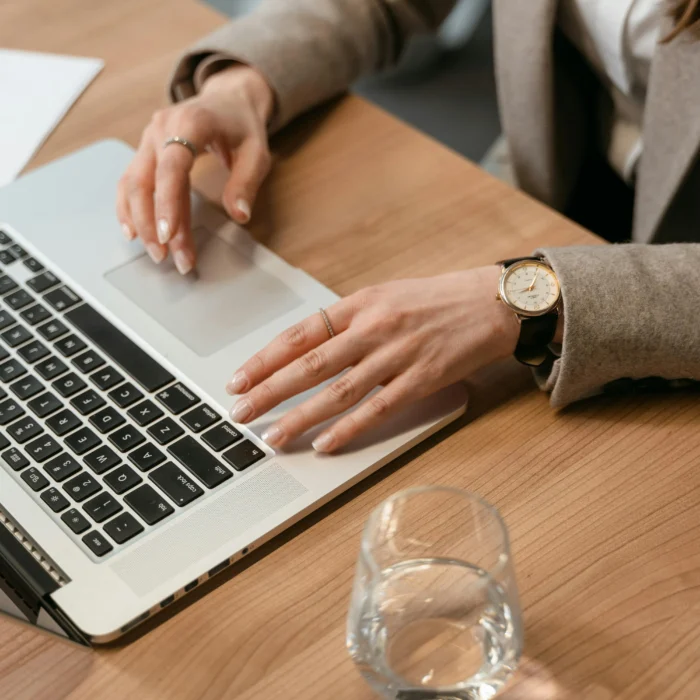 WordPress dashboard on a laptop highlighting SEO, plugins, and theme customization options